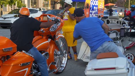 A-group-of-motorcycle-fans-meet-up-and-gather-to-go-on-a-ride-with-some-classic-bikes-with-decorative-rims-and-paint-in-Atlanta,-Georgia