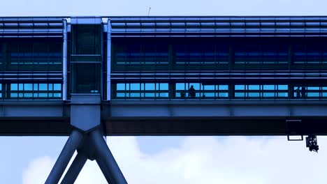 Kuala-Lumpur-city-Centre-skybridge-in-front-of-blue-sky-clouds-at-day