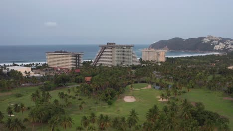 Aerial-View-of-Princess-Mundo-Imperial-Condomium-Buildings-and-Resort-on-Waterfront-of-Acapulco,-Mexico