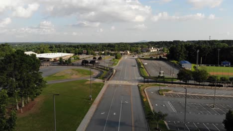 towne-lake-parkway-empty-road-woodstock-georgia-aerial-drone-descending