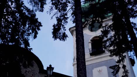 Exterior-view-in-the-nicely-maintained-park-in-front-of-the-church-at-Banska-Stiavnica,-Slovakia