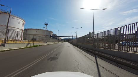 Driver-POV-passing-through-Hellenic-Petroleum-area-in-Attica-Greece