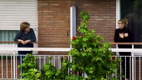 Neighbors-talking-on-the-balcony-during-a-global-pandemic