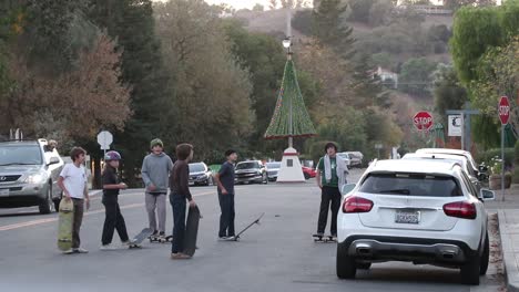 Kids-stand-in-the-street-with-their-skateboards