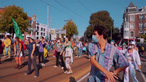 Climate-protest-dance-in-Netherlands,-XR,-medium-shot-of-people-dancing,-Netherlands,-day