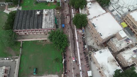 Aerial-of-entrance-of-Palitana-temple-full-of-people