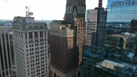 Aerial-rises-past-M-and-T-Bank-to-Bank-of-America-building-in-downtown-Baltimore-on-sunny-day