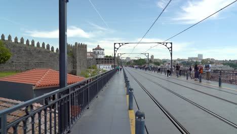 Tram-Passes-People-on-Dom-Luís-I-Bridge