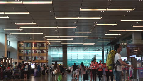 Singapore---Circa-Time-Lapse-video-of-crowded-airport-in-Singapore-with-people-moving-around-counter