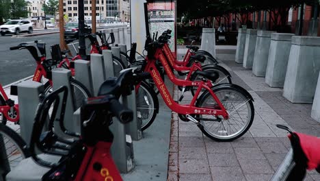 Bicycle-rental-station-in-an-urban-location-near-offices-and-a-subway-station