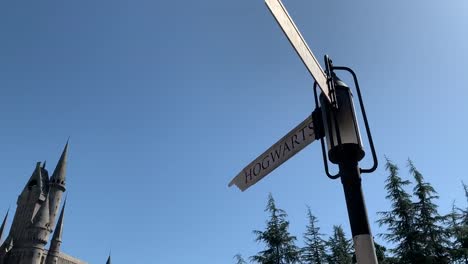 The-famous-Harry-Potter-Castle-at-Universal-Studios-Hollywood-with-the-sign-"Hogsworth"-pointing-at-it