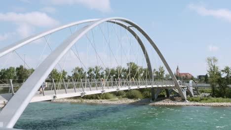 Calgarians-enjoy-beautiful-pedestrian-suspension-bridge,-East-Village