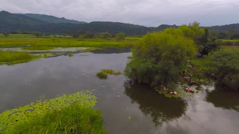 Aerial-view-from-drone-of-the-El-Porvenir-lagoon-in-cloudy-afternoon,-rural-area-of-Córdoba,-Veracruz,-Mexico