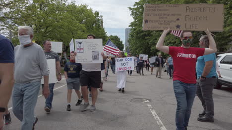 people-with-signs-protesting-stay-at-home-orders-at-ReOpen-NC-rally