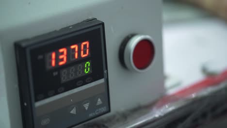 Closeup-Of-A-Worker-Operating-A-Industrial-Manufacturing-Machine,-Pressing-Button