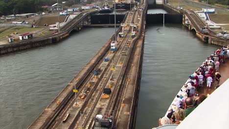 Cruise-ship-entering-Gatun-Locks-at-Panama-Canal,-view-from-the-ship's-deck