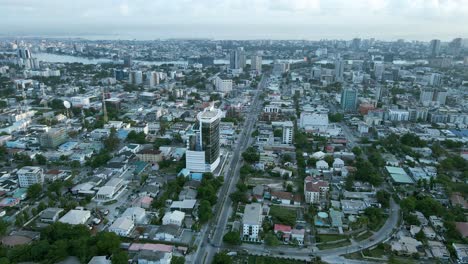 Cityscape-of-residential-buildings,-Helipad,-and-major-roads-during-sunrise