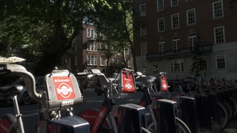 White-Van-Going-Past-Docked-Santander-Bikes-In-Smith-Square