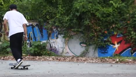 Boys-practice-skateboarding-in-an-abandoned-building-in-Denpasar,-Bali,-October-25,-2021