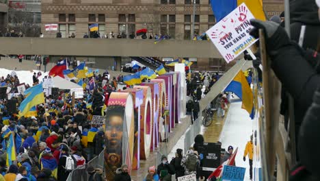 People-with-Ukrainian-flags-protest-against-Russian-invasion,-Toronto