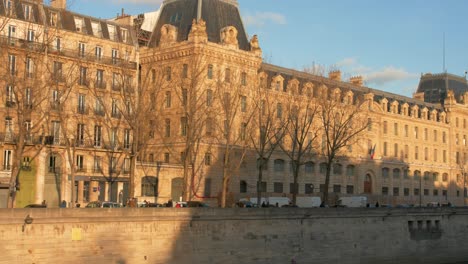 View-of-Ile-Saint-Louis-buildings-with-Quai-Orleans-on-Seine-River-in-Paris,-France-at-sunset