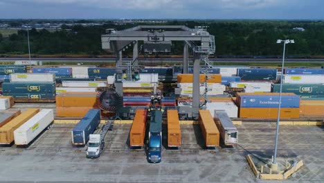 4K-Drone-Video-of-Trains-and-Trucks-at-CSX-Intermodal-Train-Yard-in-Winter-Haven,-FL