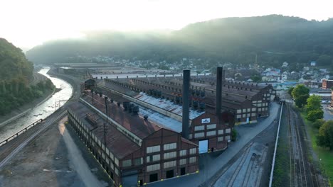 Old-steel-mill-manufacturing-plant-with-smokestack