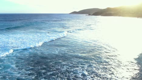 aerial-shot-of-surfers-in-action