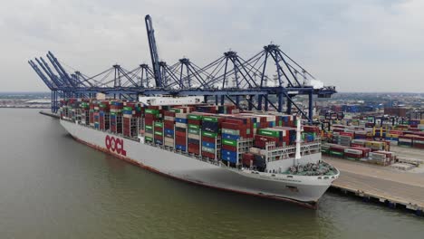 A-shipping-container-is-unloaded-at-the-docks-in-Felixstowe,-Suffolk,-UK