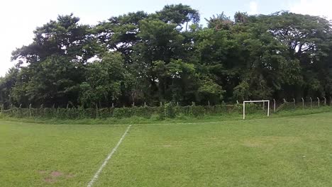 View-of-a-group-of-young-women-in-the-middle-of-a-soccer-training,-recorded-from-a-drone