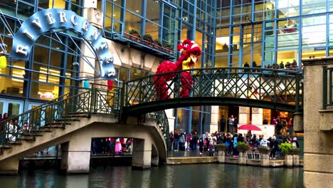 Chinese-Dragons-dance-in-celebration-of-the-Confucius-Lantern-Festival,-on-the-San-Antonio-Riverwalk