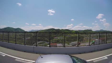 Bus-tour-with-a-go-pro-side-view-of-the-forest-and-town-passing-by