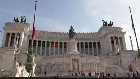 Hand-held-shot-of-the-well-attended-Monumento-a-Vittorio-Emanuele-II-with-beautiful-detailed-statue-at-the-roof-and-in-the-front-of-the-building