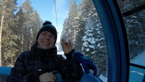 Girl-in-a-cable-car-waving-to-the-camera