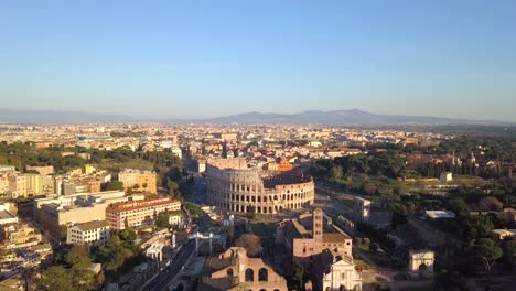 Beautiful-Aerial-Drone-shot-from-a-distance-Colosseum-Rome,-Italy