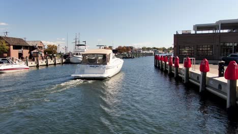 Drone-following-boat-out-of-Ego-Alley,-toward-Severn-River