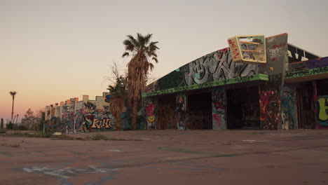 Nostalgic-abandoned-lake-Dolores-waterpark-California-sliding-wide-shot