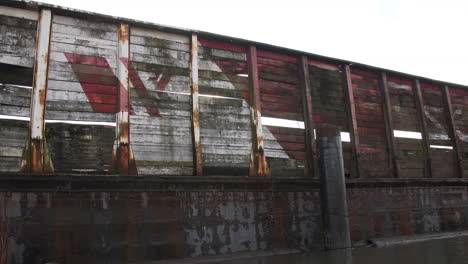 Old-Rusty-and-Rotten-Barge-Long-Tracking-Shot-with-Sunflares