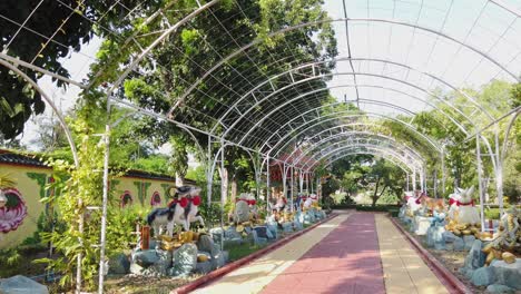 Pan-R-across-colorful-statues-at-Wihan-Phra-Phothisat-Kuan-Im-temple