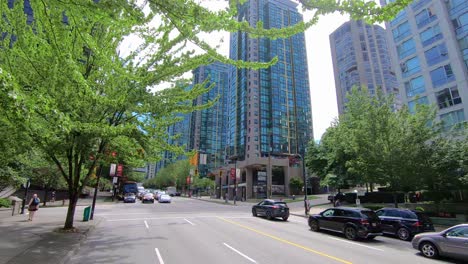 Driving-down-multi-lane-road-through-center-of-city-Seattle,-US