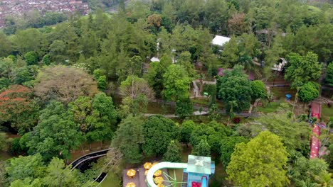 Swimming-pool-and-children-playground-facilities-in-Kyai-Langgeng-Park,-Magelang