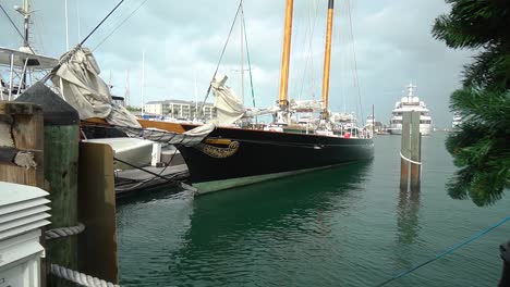 Wide-Shot-of-Classic-Clipper-Ship-on-Beautiful-Calm-Water-Docked-at-Marina