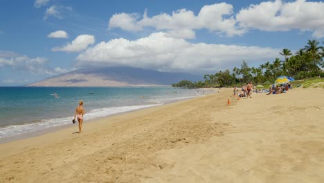 Lady-walking-alone-on-the-beach-during-the-day