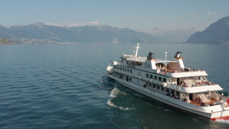 Aerial-of-beautiful-passenger-ship-driving-over-beautiful-lake