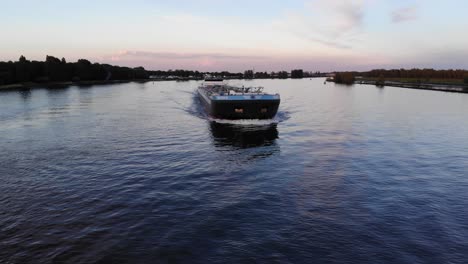 Liquid-Cargo-Ship-Sailing-Against-Beautiful-Sunset-Sky-In-Netherlands