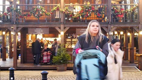 German-wooden-Christmas-market-bar-serving-beer-in-evening-Liverpool-city-street-festivity