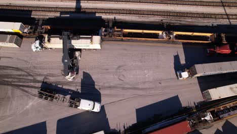 Trucks-and-stacker-moving-at-container-shipping-terminal-of-Vancouver-in-Canada