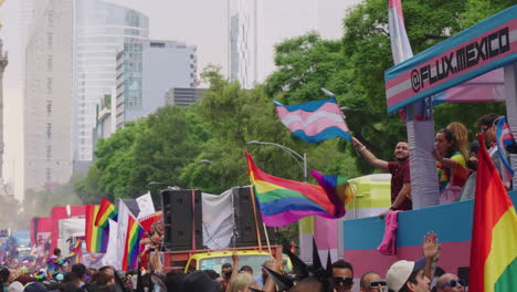 People-Waving-Rainbow-Flags-From-Moving-Vehicles-During-Pride-Parade-Along-Avenue-Juarez-In-Mexico-City