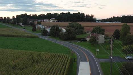 Tractor-trailer-truck-makes-delivery-on-rural-road-in-USA