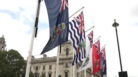 Commonwealth-Flags-Fluttering-In-Wind-At-Parliament-Square-In-Westminster